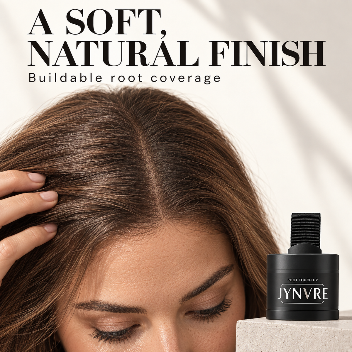 Close-up of softly colored roots and JYNVRE powder compact